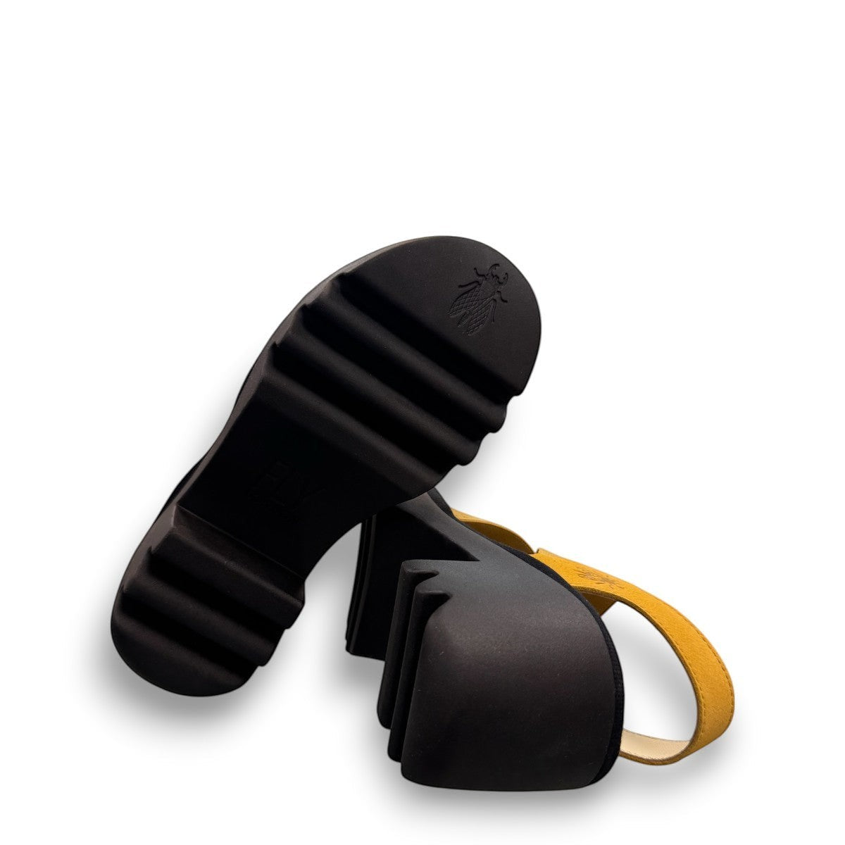 Fly London Taji502fly cupido bumblebee yellow elastic and leather platform sandals with a chunky lugged rubber sole.