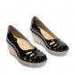 Fly London Yubi480fly- nappalak black patent leather wedge shoe with cut-out details and a translucent rubber sole.