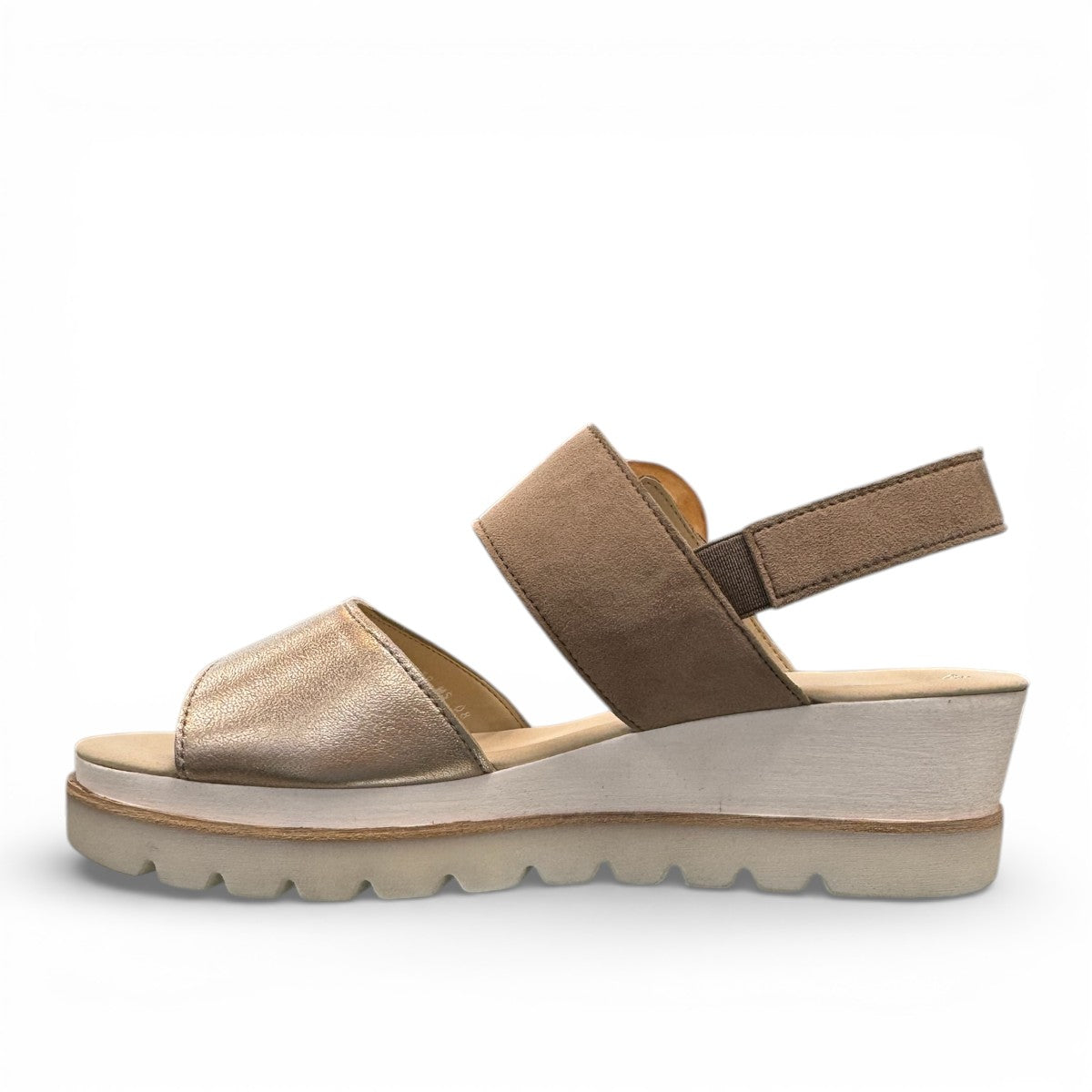 Gabor wedge sandal in metallic gold and suede puder with a decorative buckle and velcro strap. Photo of left side view.