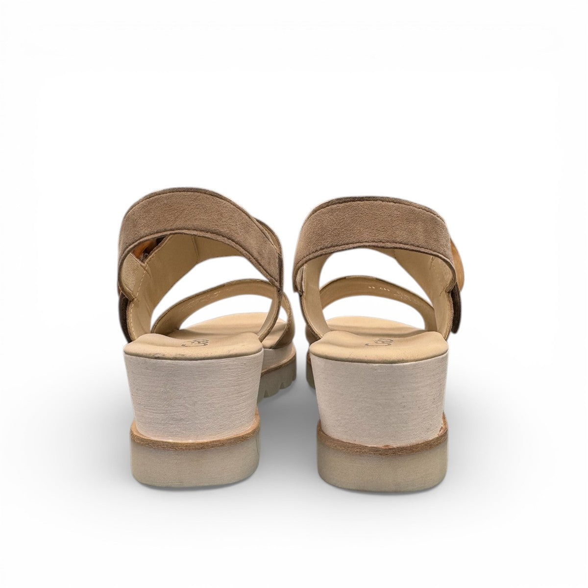 Gabor wedge sandal in metallic gold and suede puder with a decorative buckle and velcro strap. Photo of back view.
