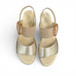 Gabor wedge sandal in metallic gold and suede puder with a decorative buckle and velcro strap. Photo of upper view.