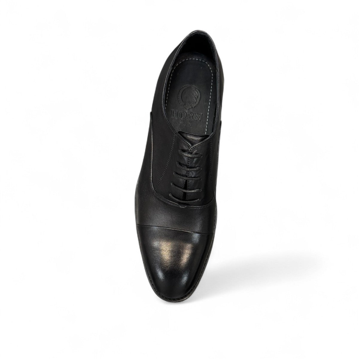 Horn Shoes Arjhand black leather oxford shoes with a classic cap toe design and lace-up closure. Photo of upper view.