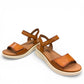 JOSEF SEIBEL Sevran 01 amber leather sandals with a cushioned EVA wedge sole and Velcro strap.
photo of the front.
