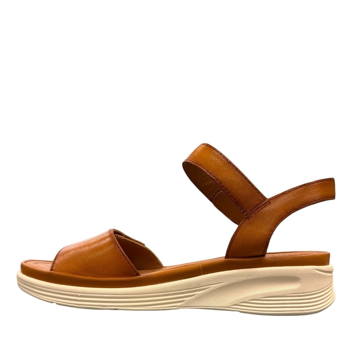 JOSEF SEIBEL Sevran 01 amber leather sandals with a cushioned EVA wedge sole and Velcro strap.
photo of the left side.