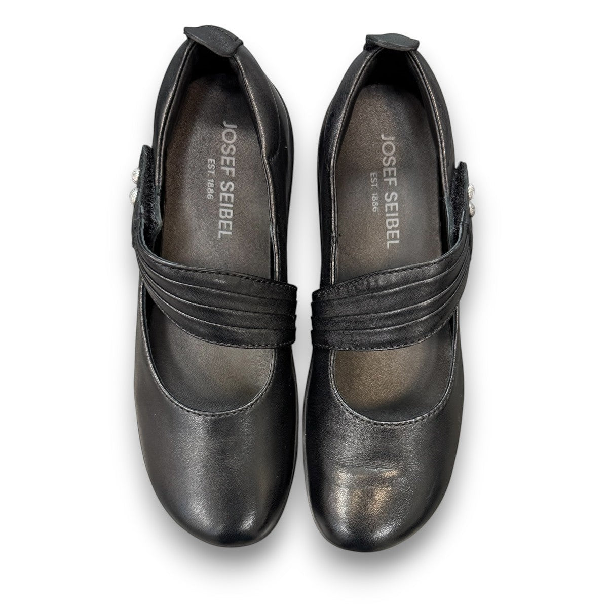 Josef Seibel Charlotte 03 black leather mary jane shoe with a side strap and durable rubber sole. photo of the top.
