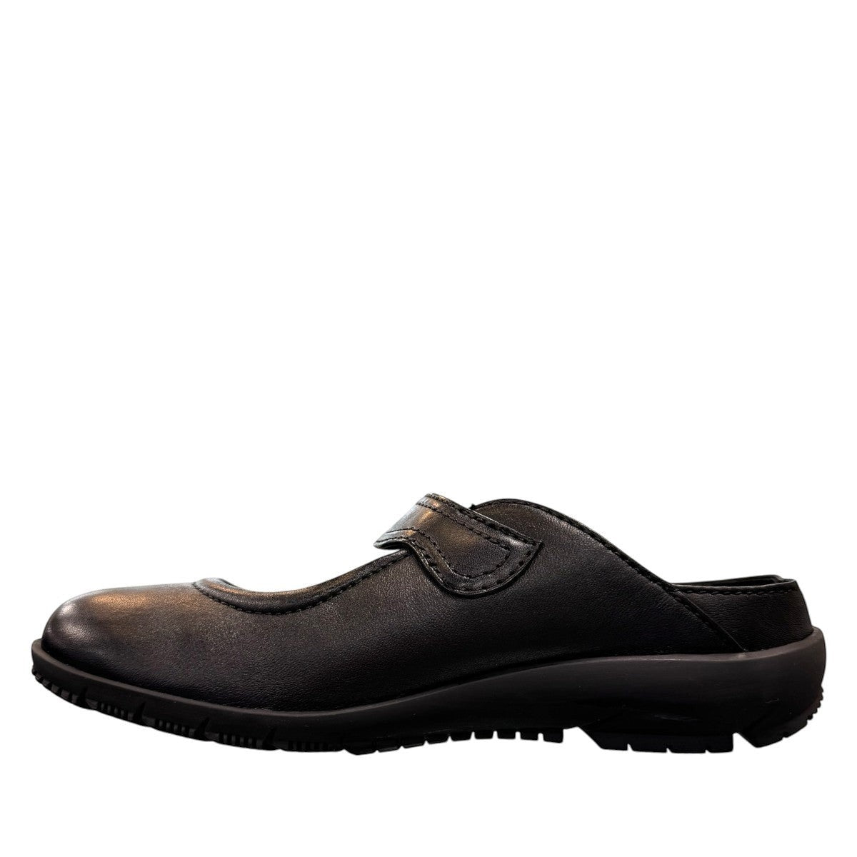 Josef Seibel Charlotte 04 black leather slip-on shoe with a comfortable rubber sole and strap detail. photo of the left side.