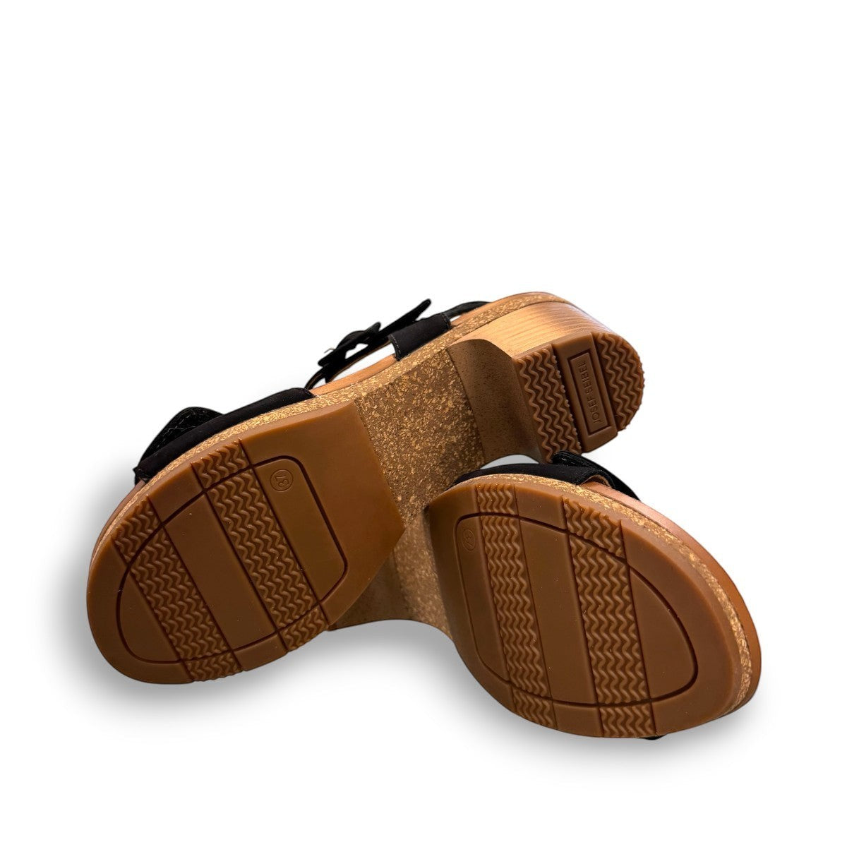 Josef Seibel Grace 11 black leather sandal with adjustable straps and cork latex block heel.
photo of the bottom.