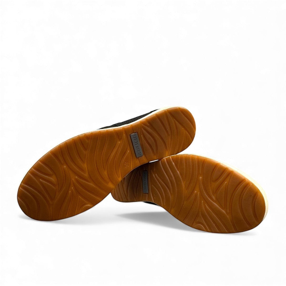 Josef Seibel Caren 67 black leather slip-on shoes showing the flexible brown TR-light patterned soles