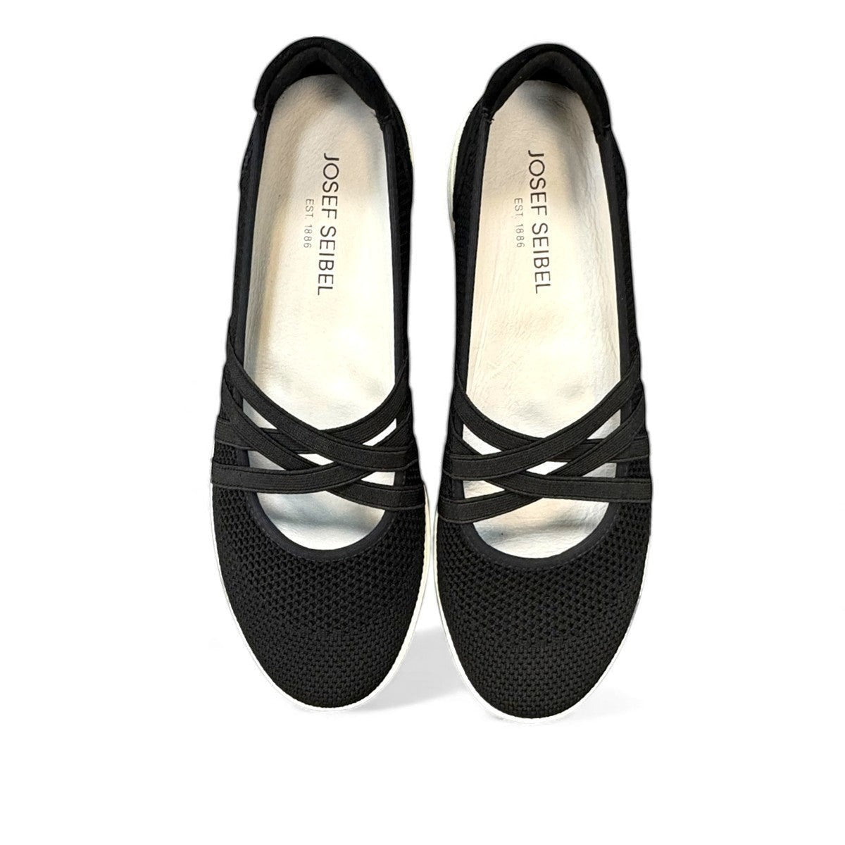 Josef Seibel Caren 67 black leather slip-on shoes showing the flexible brown TR-light patterned soles