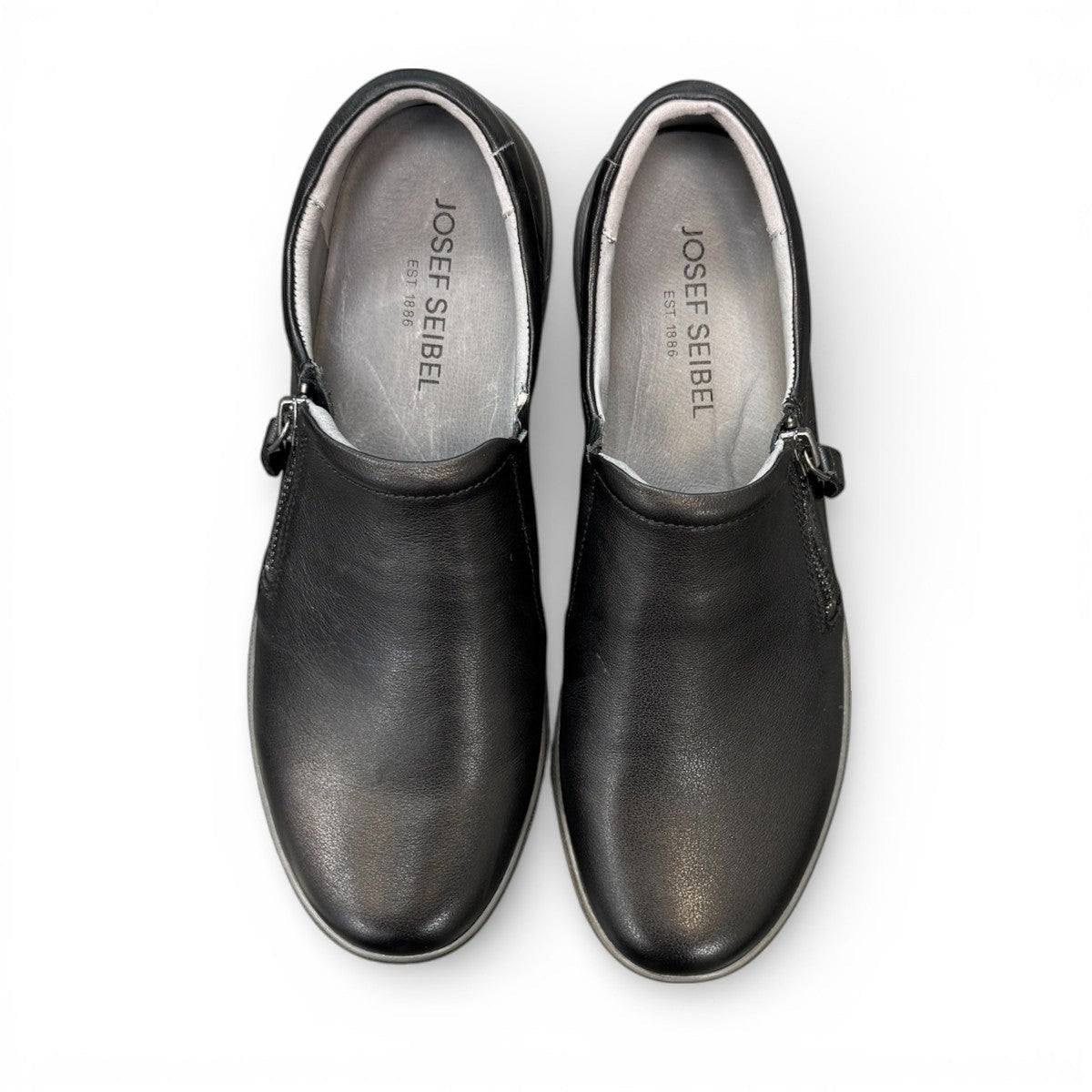 Josef Seibel Caren 23 black leather slip-on shoe with side zipper and comfortable rubber sole. photo of the top.