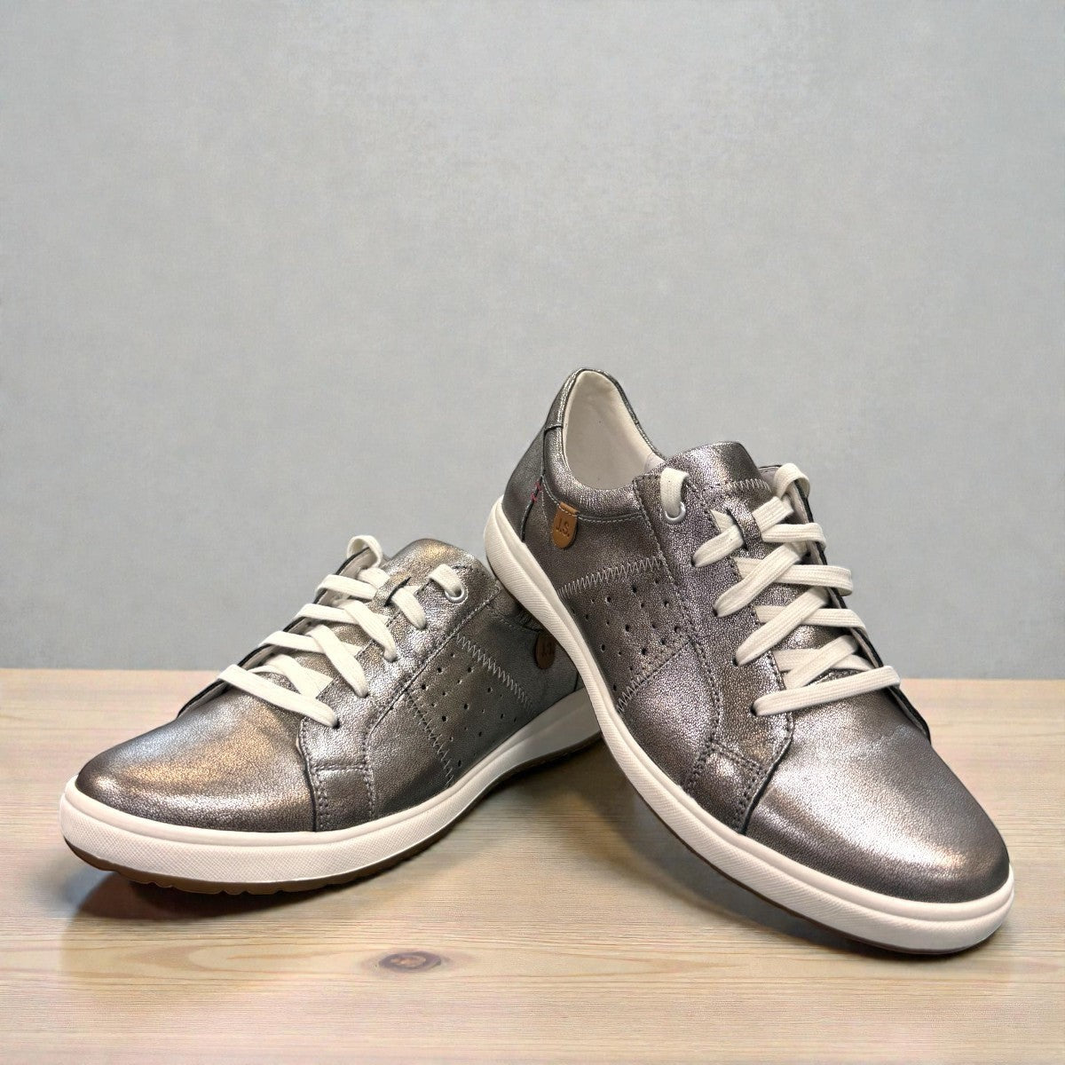 Josef Seibel Caren 01 platinum metallic leather lace-up sneaker with perforated side detail. photo of the front.