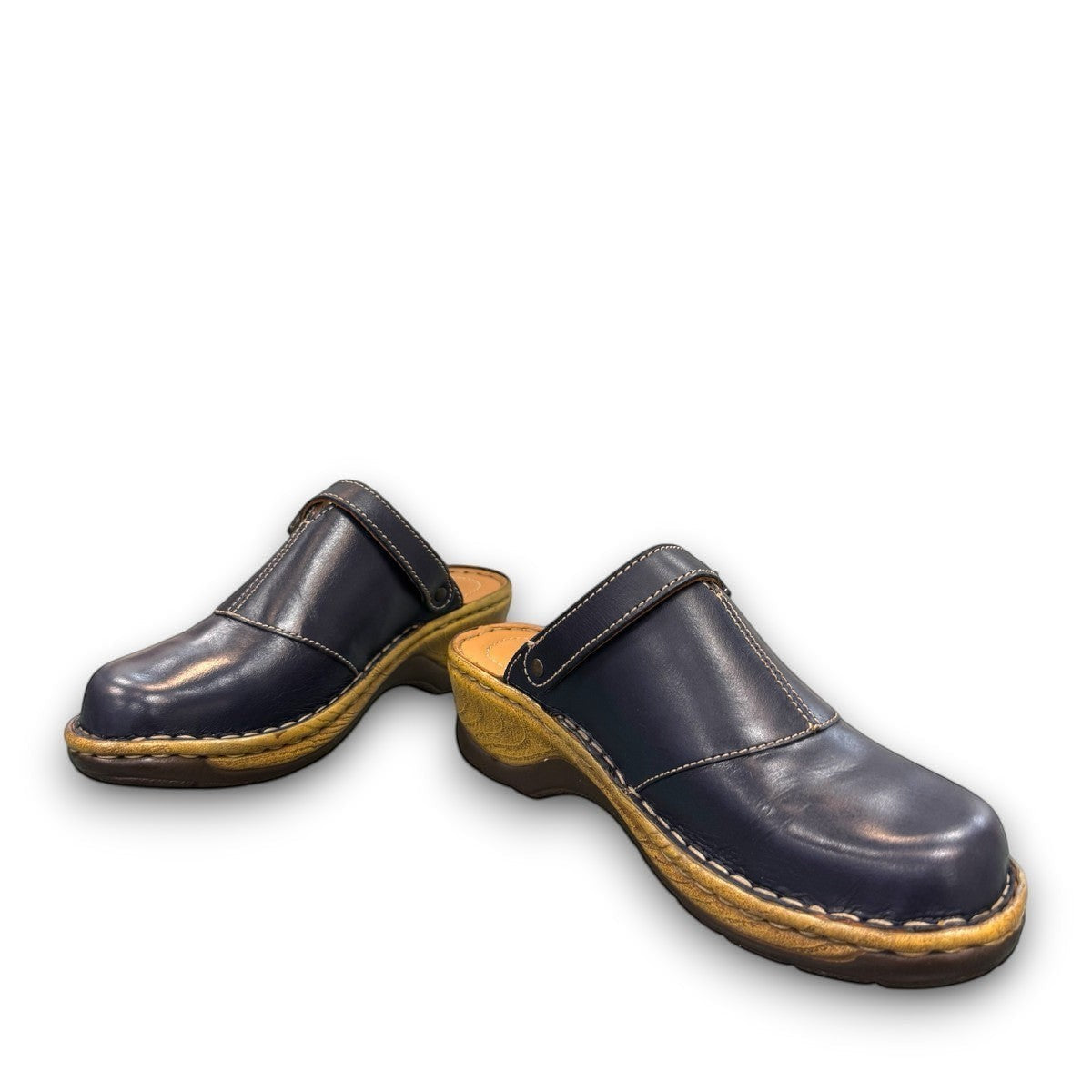 JOSEF SEIBEL Catalonia 83 indigo leather clogs with a decorative buckle and sturdy wood-look PU sole.