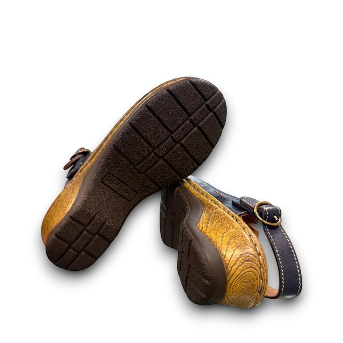 JOSEF SEIBEL Catalonia 83 indigo leather clogs with a decorative buckle and sturdy wood-look PU sole.