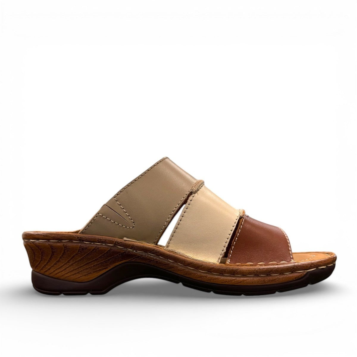 Josef Seibel Catalonia 86 cognac and beige leather wedge slide sandals with open toe design. photo of the left side.