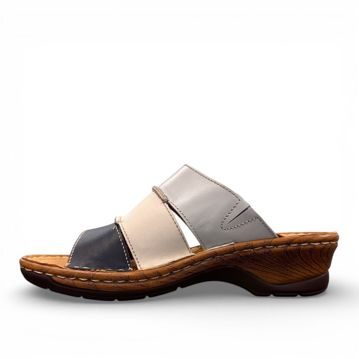 Josef Seibel Catalonia 86 wedge sandals in ocean blue and white leather with a slip-on design. photo of the left side.