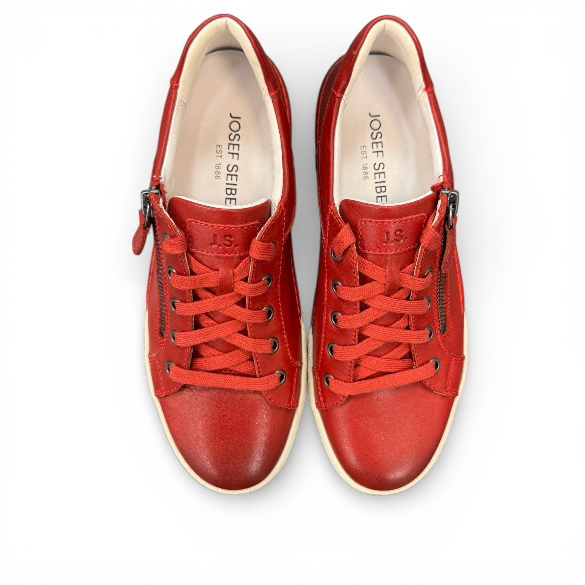 Josef Seibel Claire 03 hibiscus red leather sneaker with side zip and white rubber sole. photo of the top.