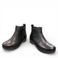 Sina Footwear Josef Seibel Darla 02 black leather ankle boots with side zipper and textured cork wedge sole.
photo of the front.