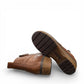 Josef Seibel Darla 02 brown leather ankle boots with side zipper and cork-textured wedge sole. photo of the bottom.