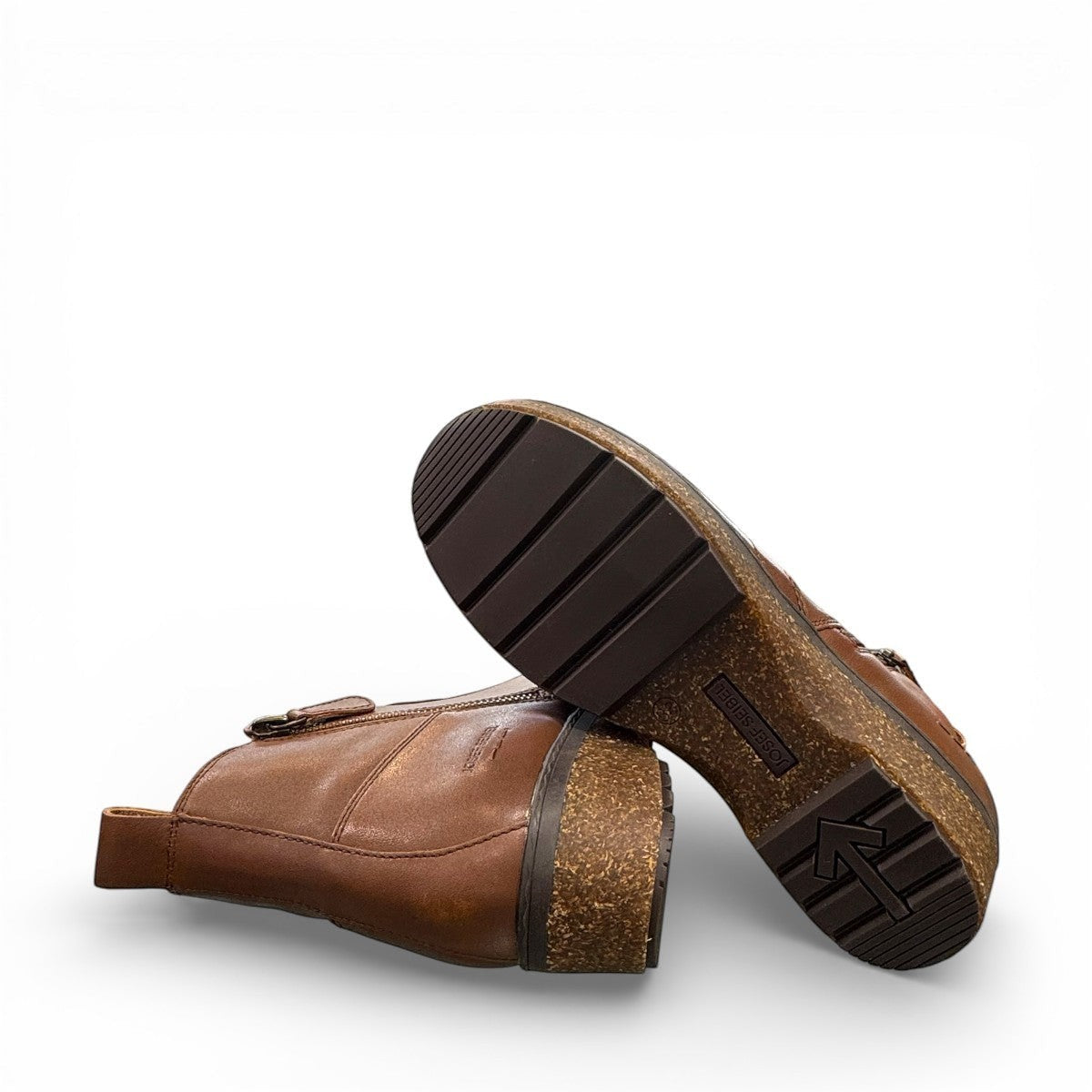 Josef Seibel Darla 02 brown leather ankle boots with side zipper and cork-textured wedge sole. photo of the bottom.