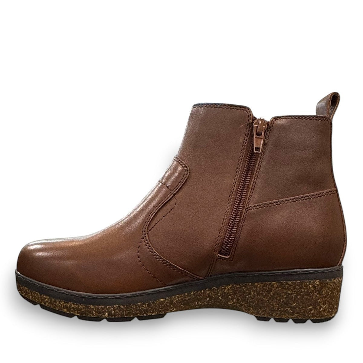 Josef Seibel Darla 02 brown leather ankle boots with side zipper and cork-textured wedge sole. photo of the left side.