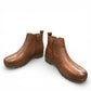 Josef Seibel Darla 02 brown leather ankle boots with side zipper and cork-textured wedge sole. photo of the front.