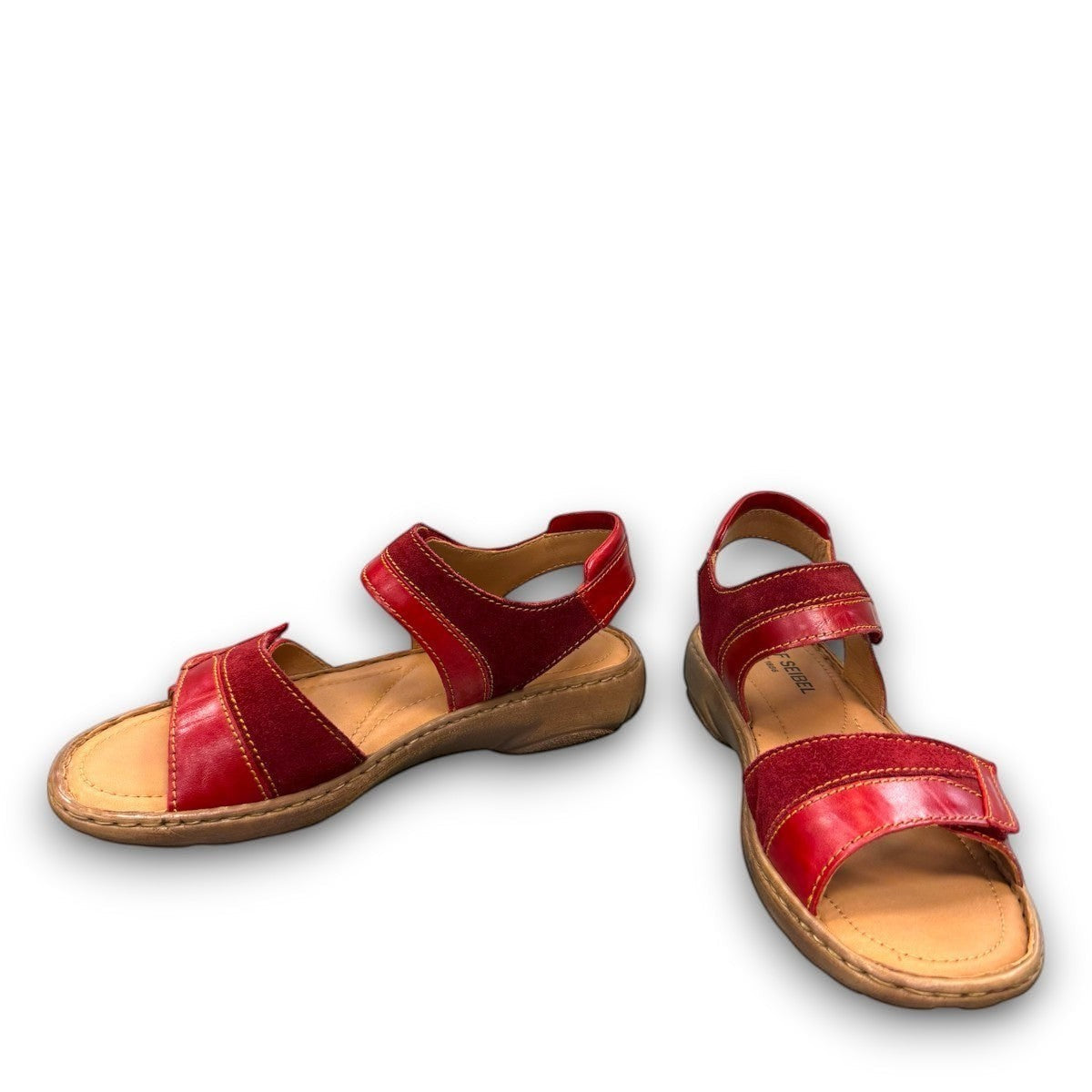 Josef Seibel Debra red leather sandals showing the durable handstitched brown textured outsoles