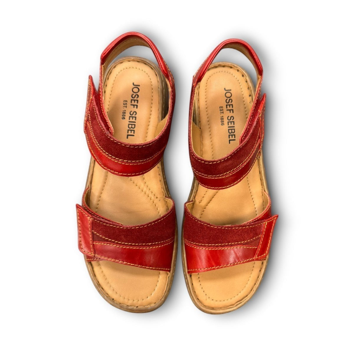 Josef Seibel Debra red leather sandals showing the durable handstitched brown textured outsoles