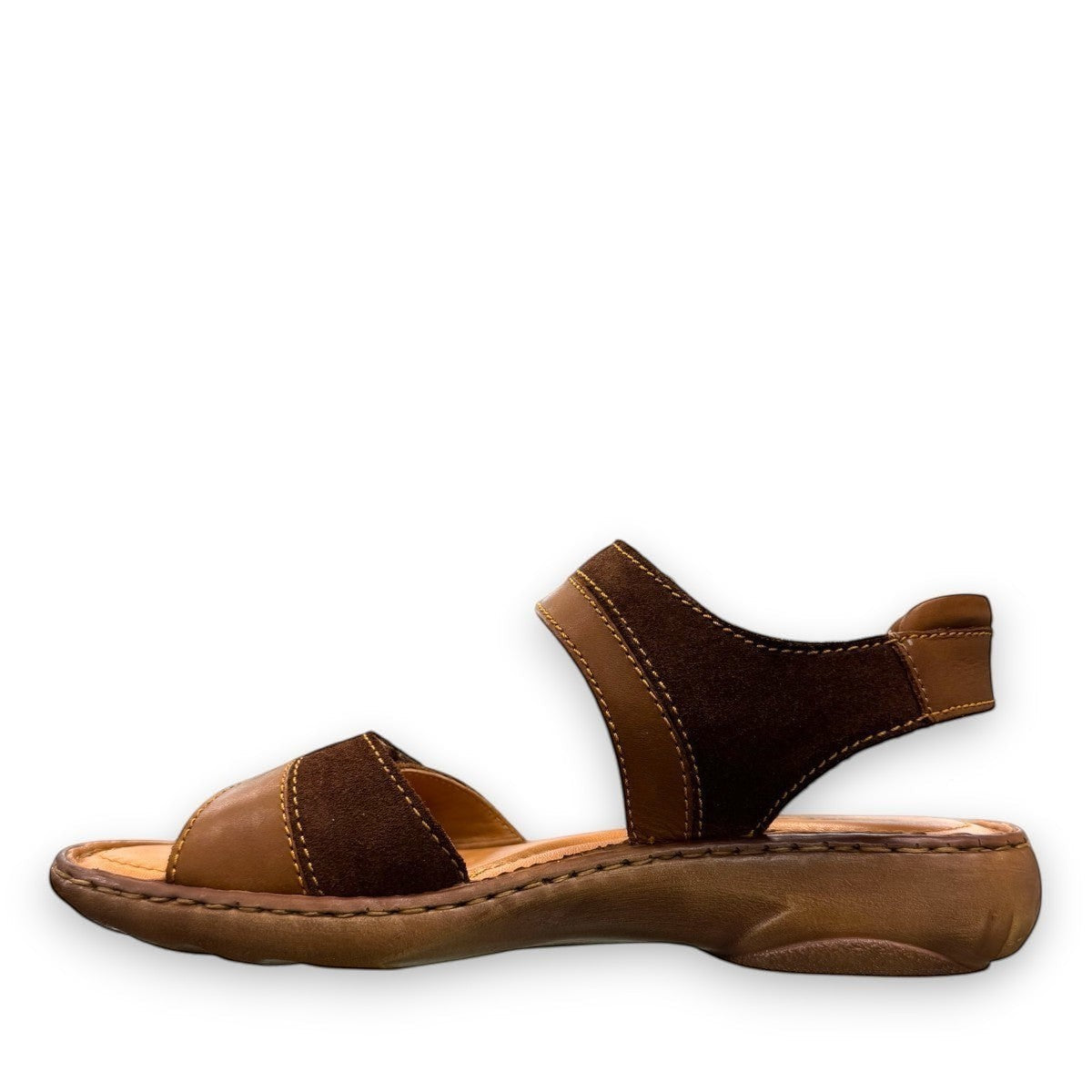 Josef Seibel Debra 019 castagne/kombe brown leather sandals showing the durable handstitched wavy tread soles