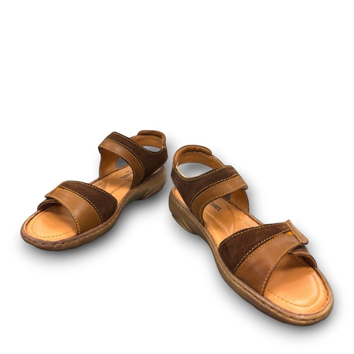 Josef Seibel Debra 019 castagne/kombe brown leather sandals showing the durable handstitched wavy tread soles