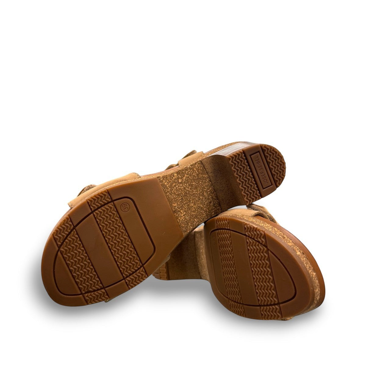 Josef Seibel Grace 11 beige leather sandal with a bow detail, adjustable strap, and cork block heel.
photo of the bottom.