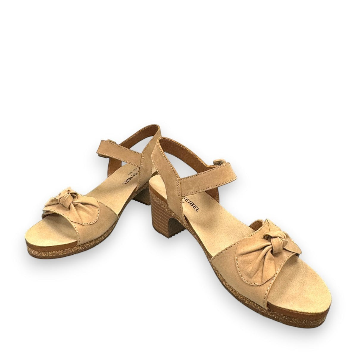 Josef Seibel Grace 11 beige leather sandal with a bow detail, adjustable strap, and cork block heel.
photo of the front.