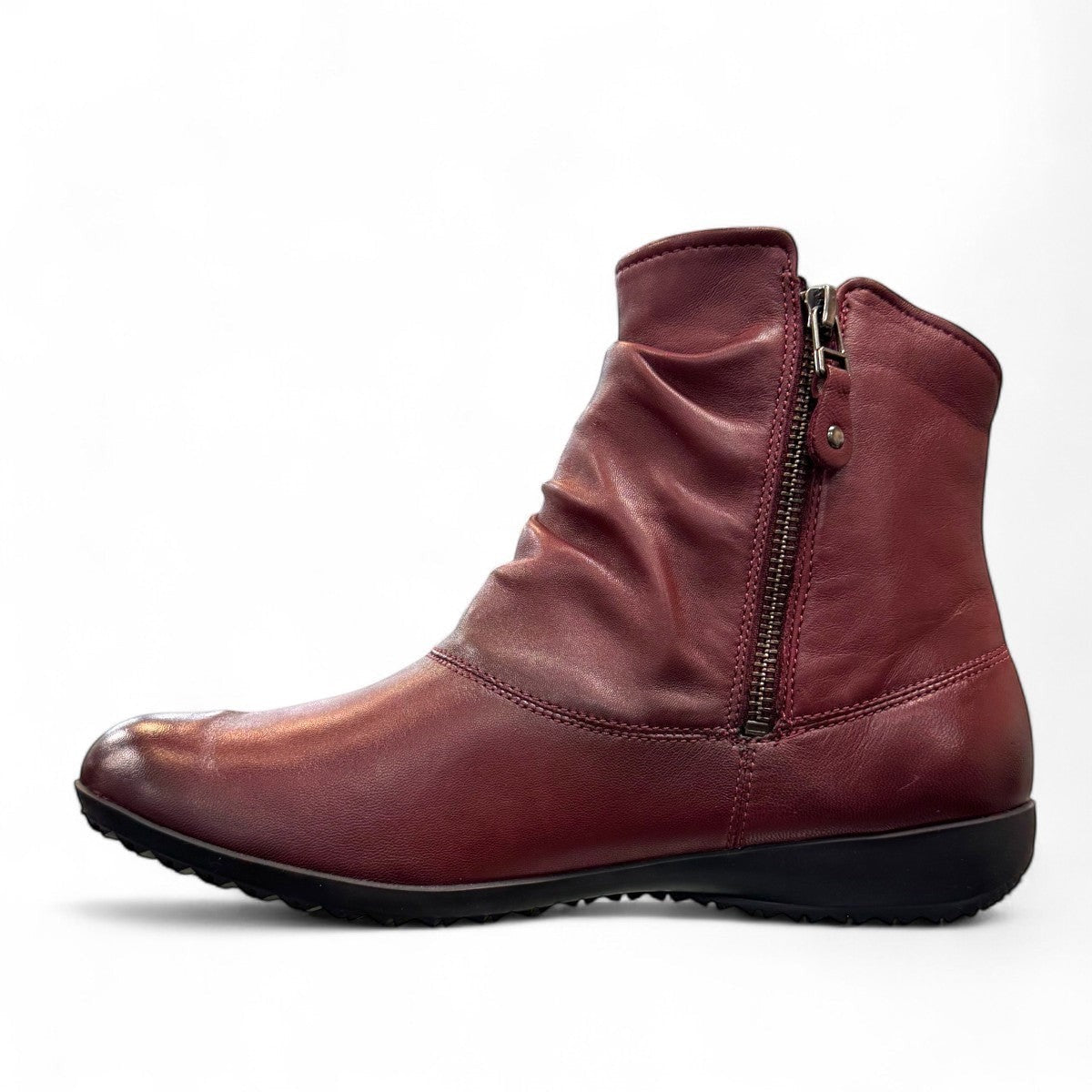 Josef Seibel Naly 24 bordo leather ruched ankle boot with side zips and a low wedge sole. photo of the left side.