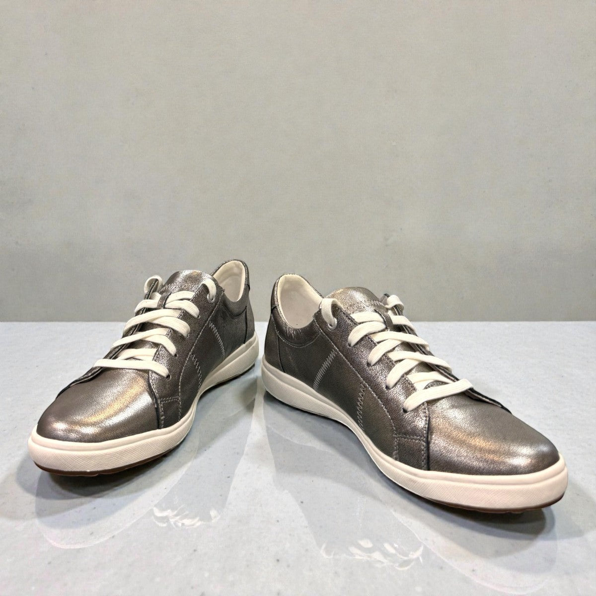 Josef Seibel Caren 01 platinum metallic leather lace-up sneaker with perforated side detail. photo of the front.