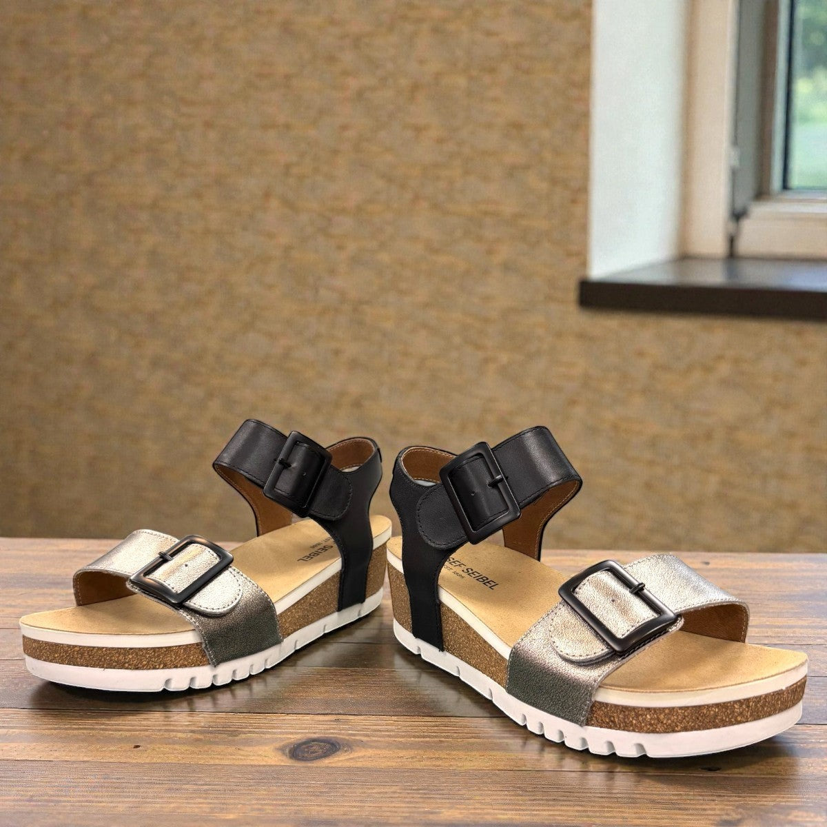 Josef Seibel Quinn 02 wedge sandal in basalt kombi leather with adjustable straps and cork midsole.
photo of the front.