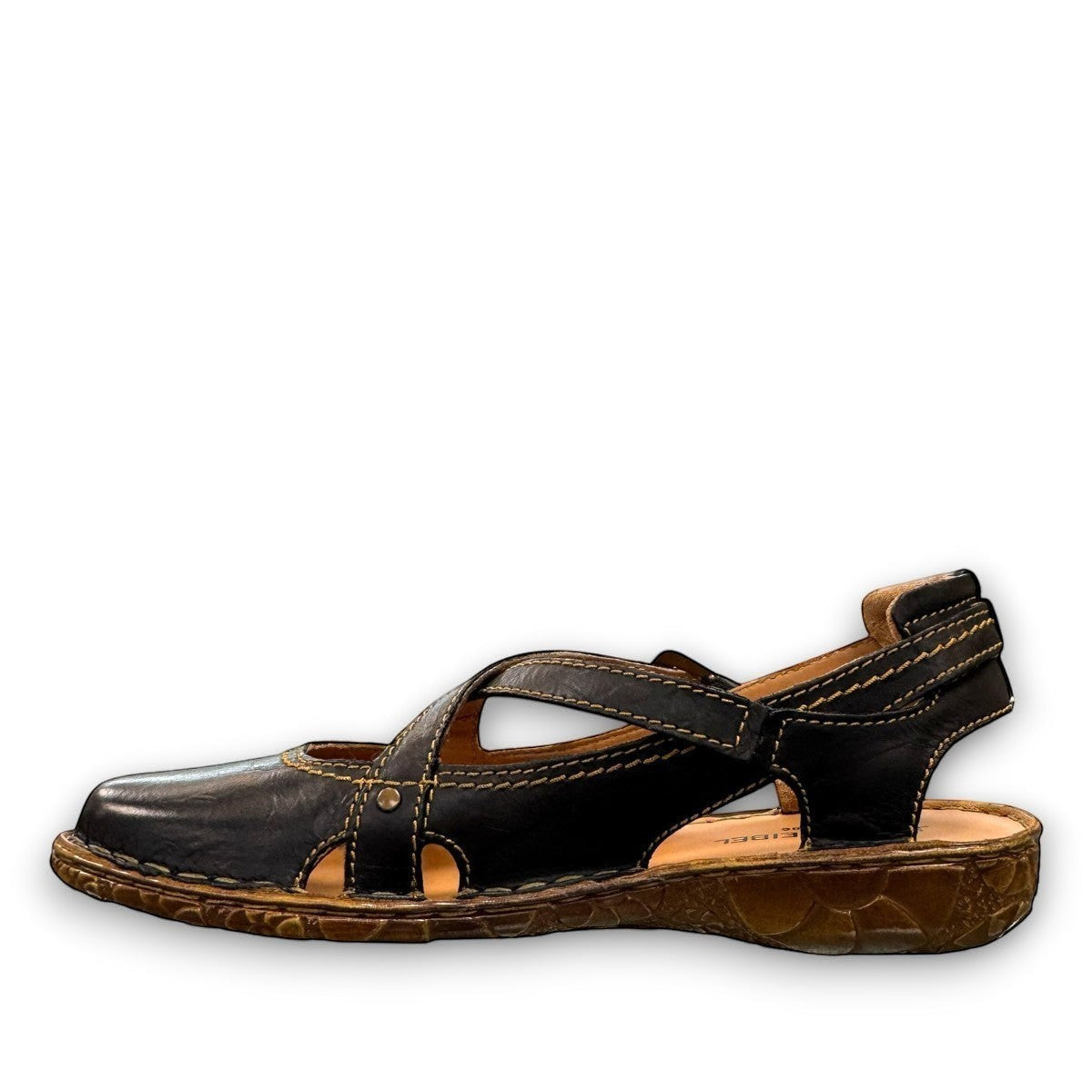 Josef Seibel Rosalie 13 black leather closed-toe open-back sandal with criss-cross straps and contrast stitching.
