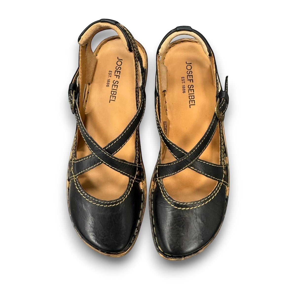 Josef Seibel Rosalie 13 black oiled leather mary jane sandals with criss-cross straps and contrast stitching.
Photo from the top.