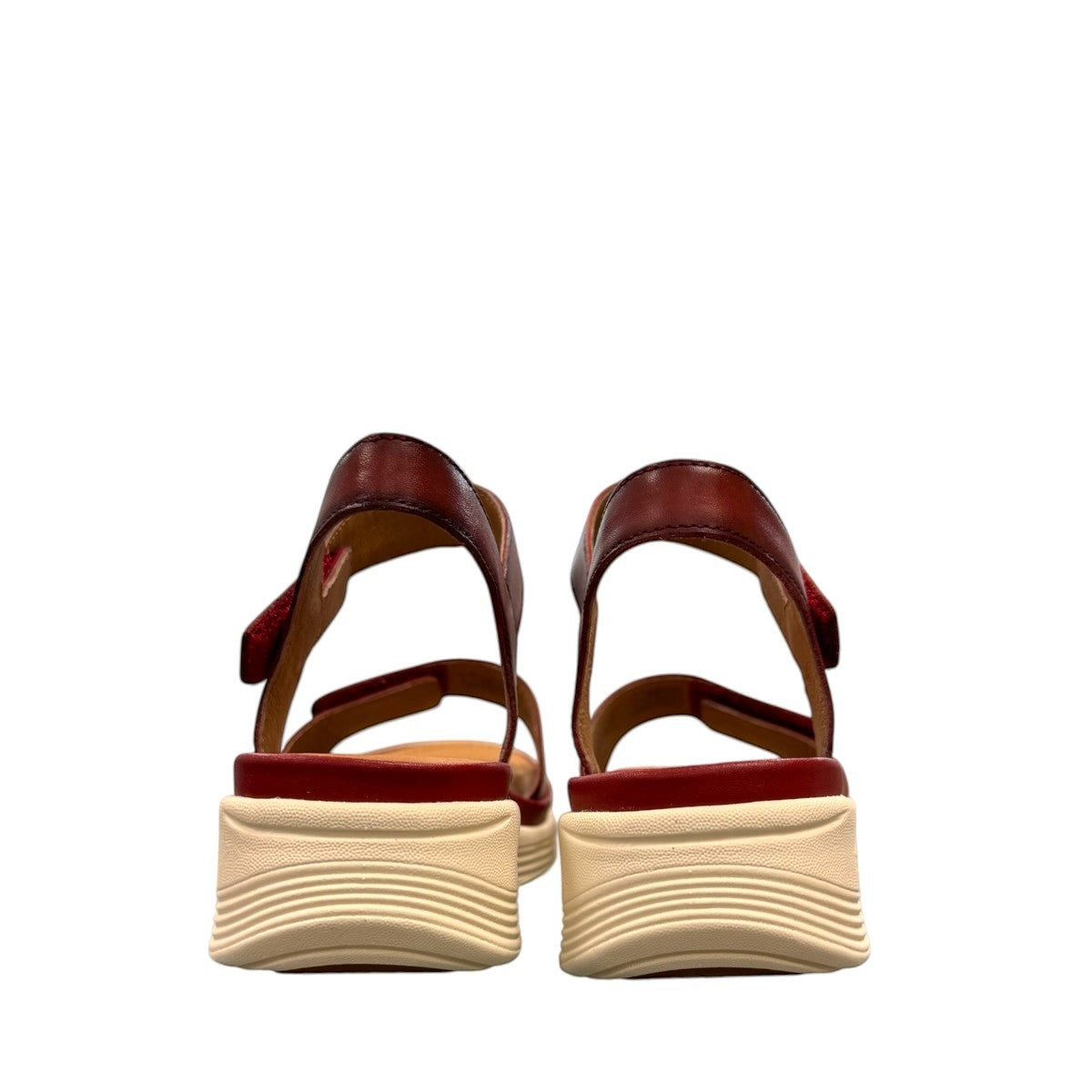 JOSEF SEIBEL Sevran 01 hibiscus leather sandals showing the textured EVA wedge sole from below JOSEF SEIBEL Sevran 01 hibiscus leather sandals showing the textured EVA wedge sole from below