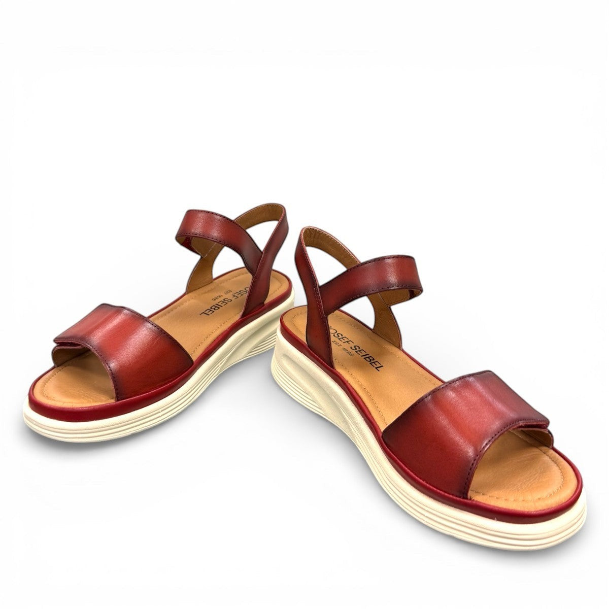 JOSEF SEIBEL Sevran 01 hibiscus leather sandals showing the textured EVA wedge sole from below