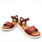JOSEF SEIBEL Sevran 01 hibiscus leather sandals showing the textured EVA wedge sole from below