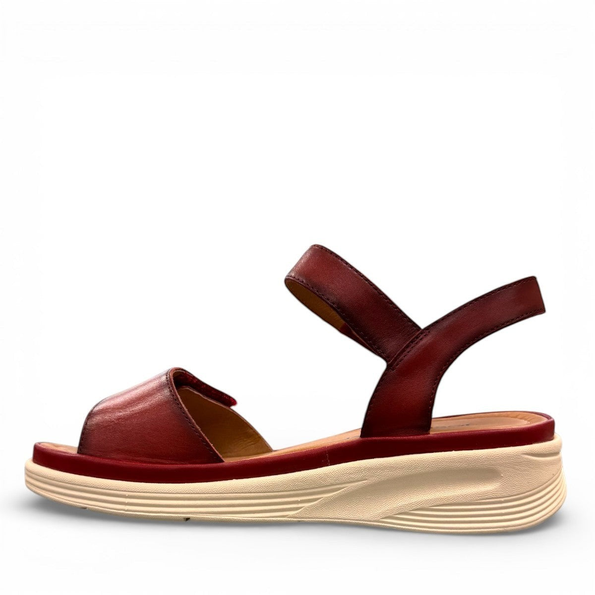 JOSEF SEIBEL Sevran 01 hibiscus leather sandals showing the textured EVA wedge sole from below