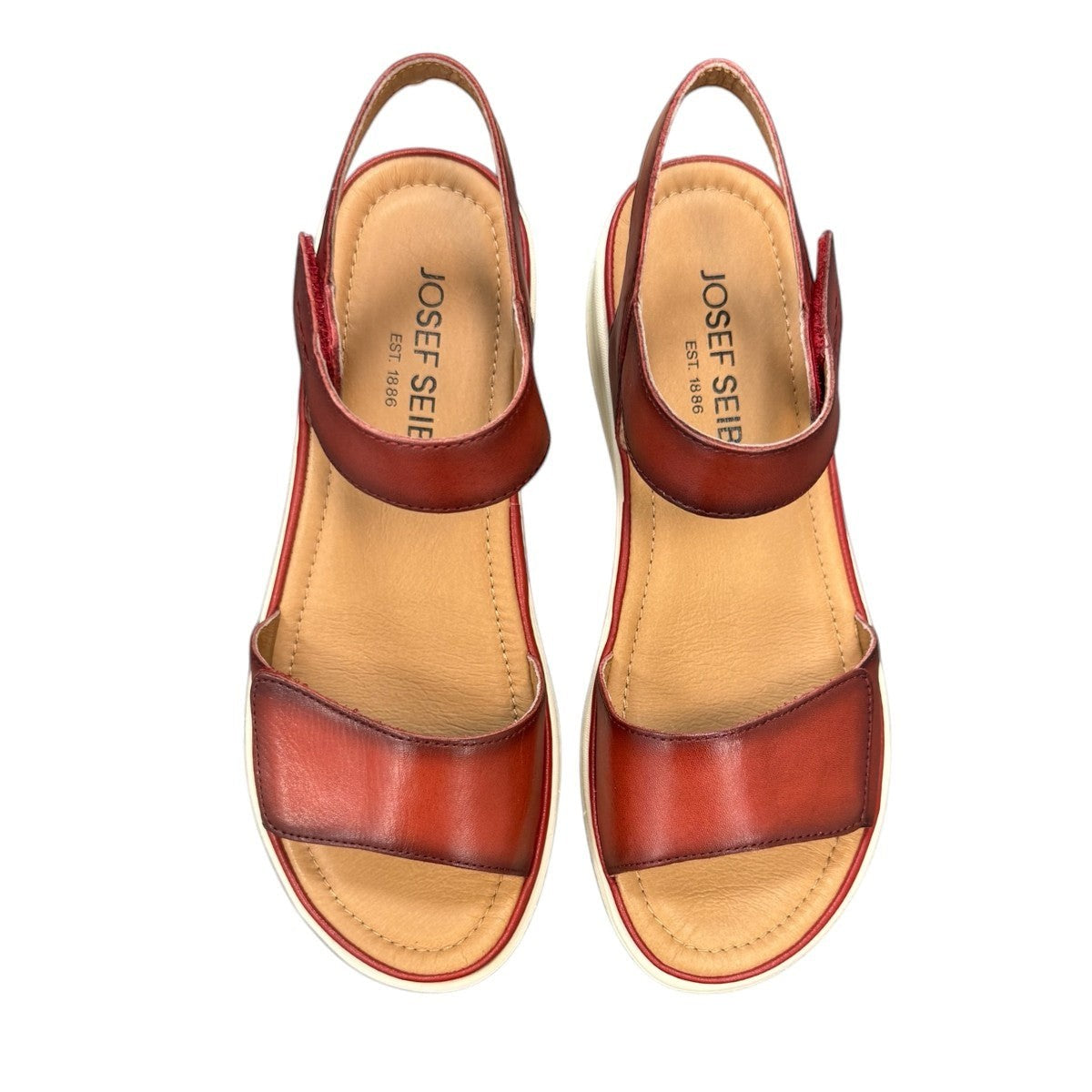 JOSEF SEIBEL Sevran 01 hibiscus leather sandals showing the textured EVA wedge sole from below