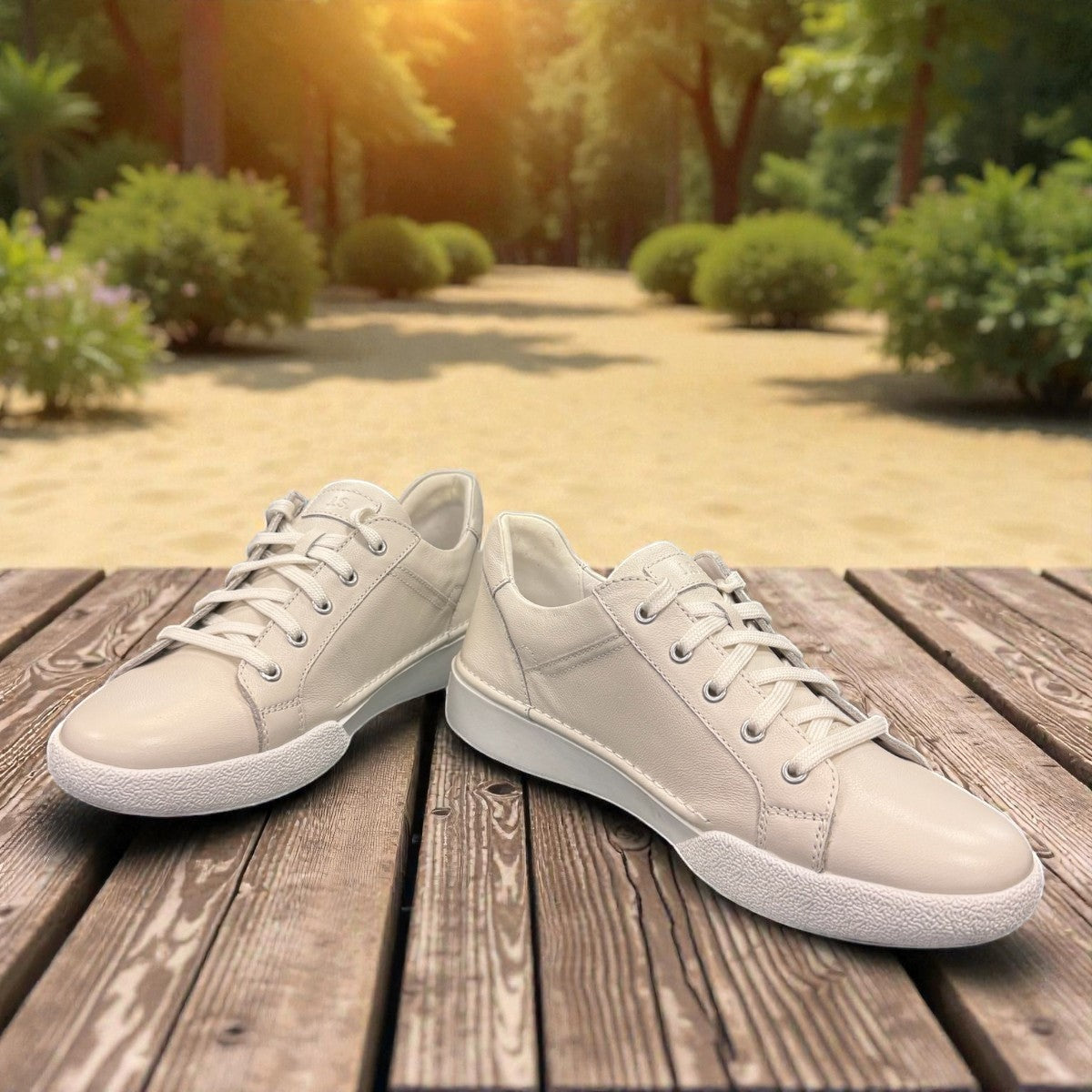 Josef Seibel Claire 03 white leather sneakers with side zip and lace-up closure on a rubber sole. photo of the front.
