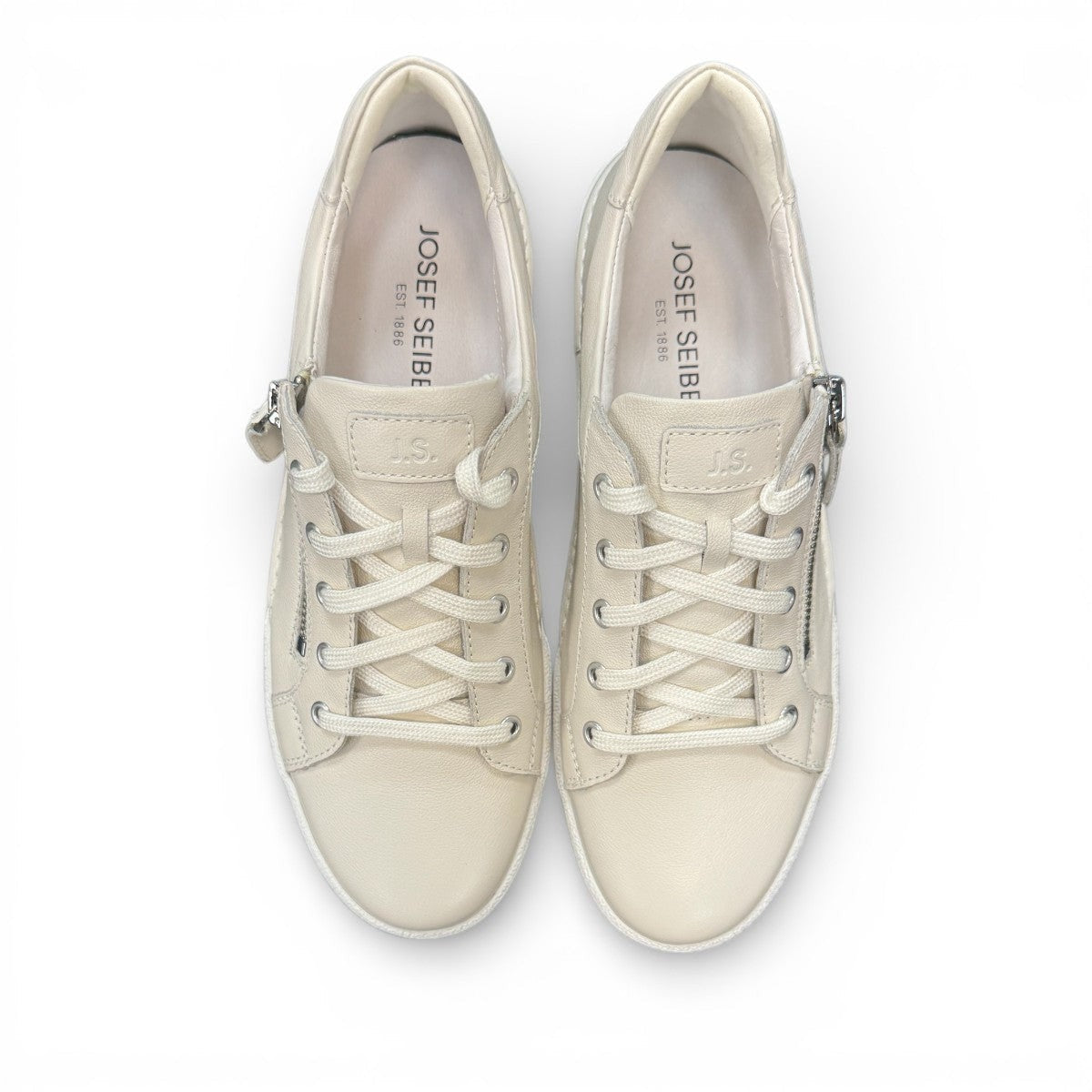 Josef Seibel Claire 03 white leather sneakers with side zip and lace-up closure on a rubber sole. photo of the top.