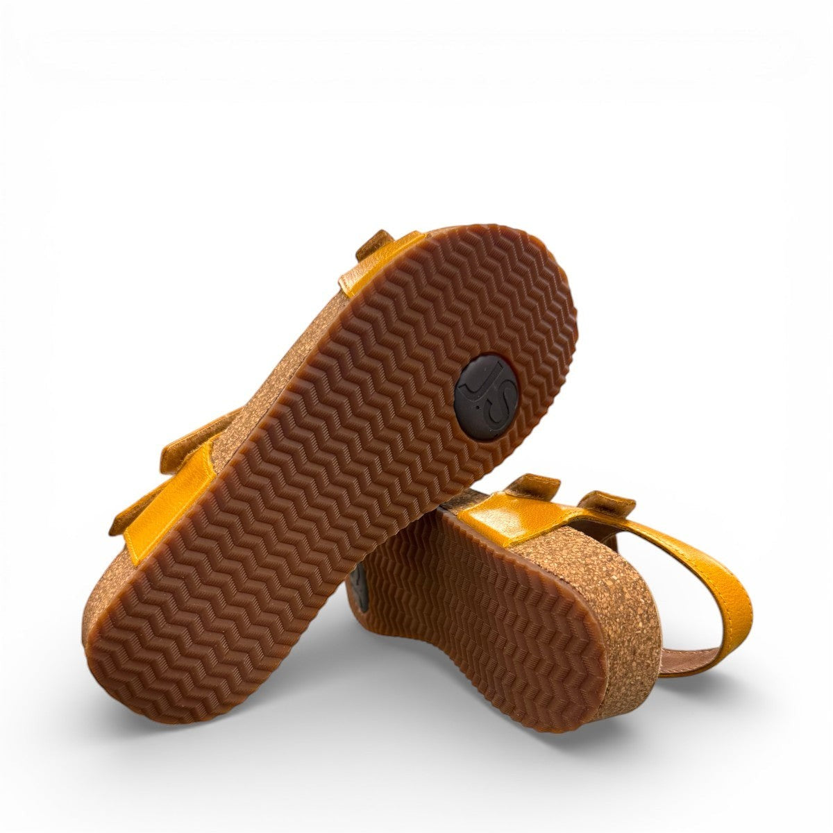 Josef Seibel Tonga 25 yellow leather sandal with three adjustable hook and loop straps and cork midsole. photo of the bottom.