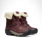 KEEN Betty waterproof winter boot in burgundy leather with a beige faux-fur cuff and rubber outsole