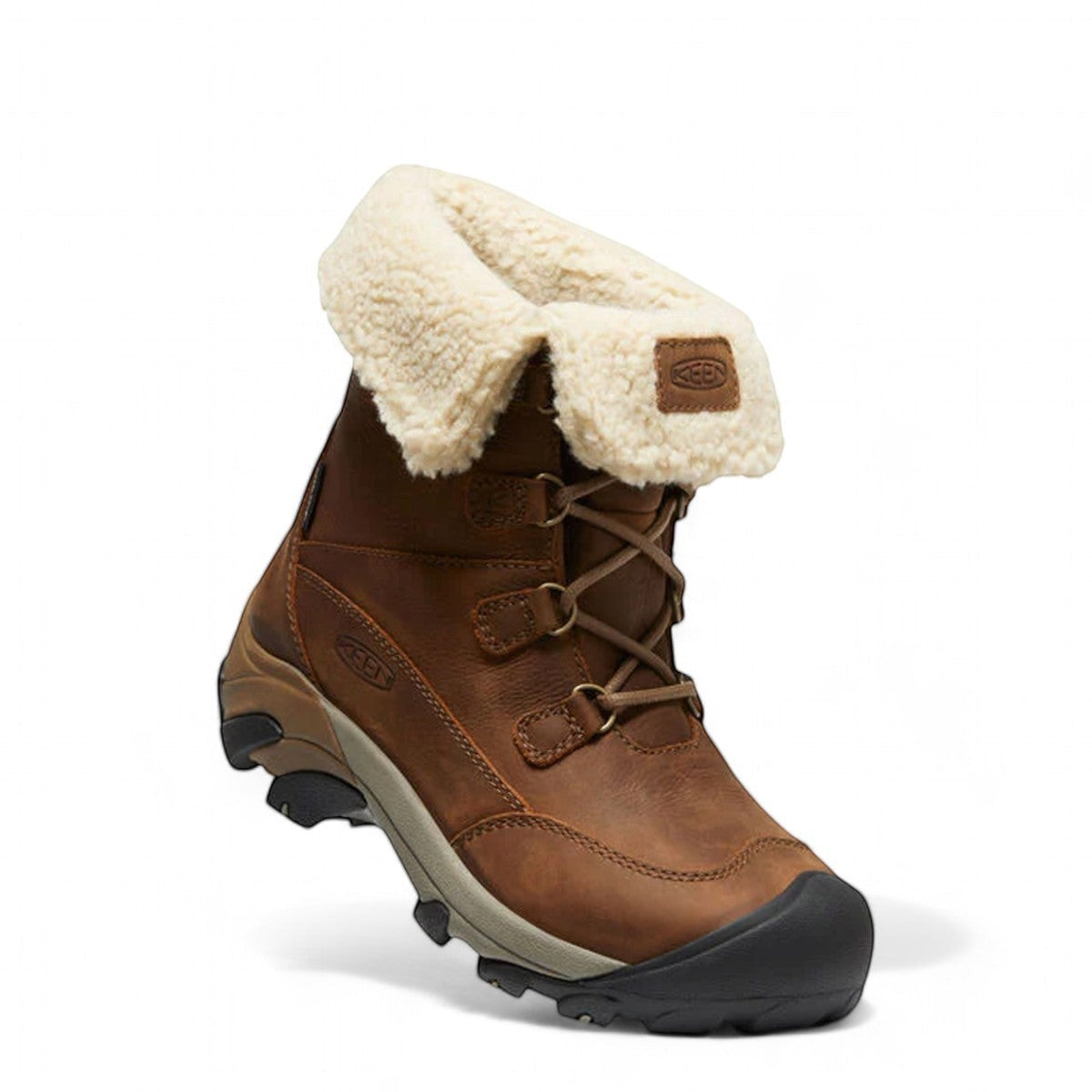KEEN Betty Boot Short WP women's brown waterproof leather winter boots with faux fur lining and lace-up closure.