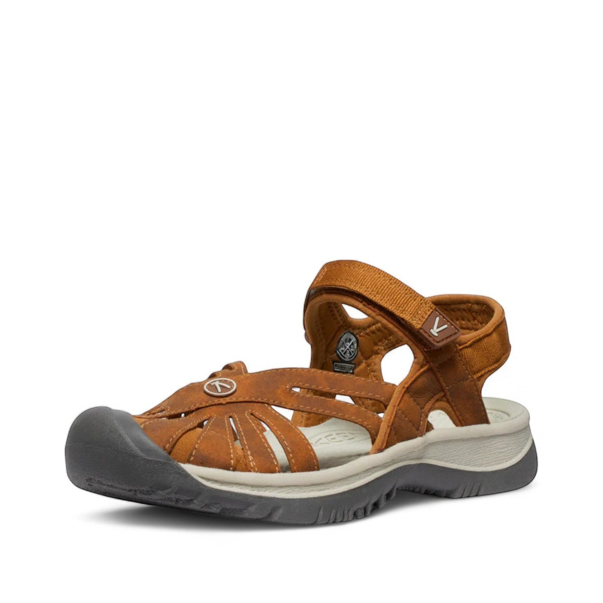 KEEN WOMEN'S ROSE SANDAL- ROASTED PECAN/BIRCH. Brown leather caged sandal with adjustable straps and toe bumper.