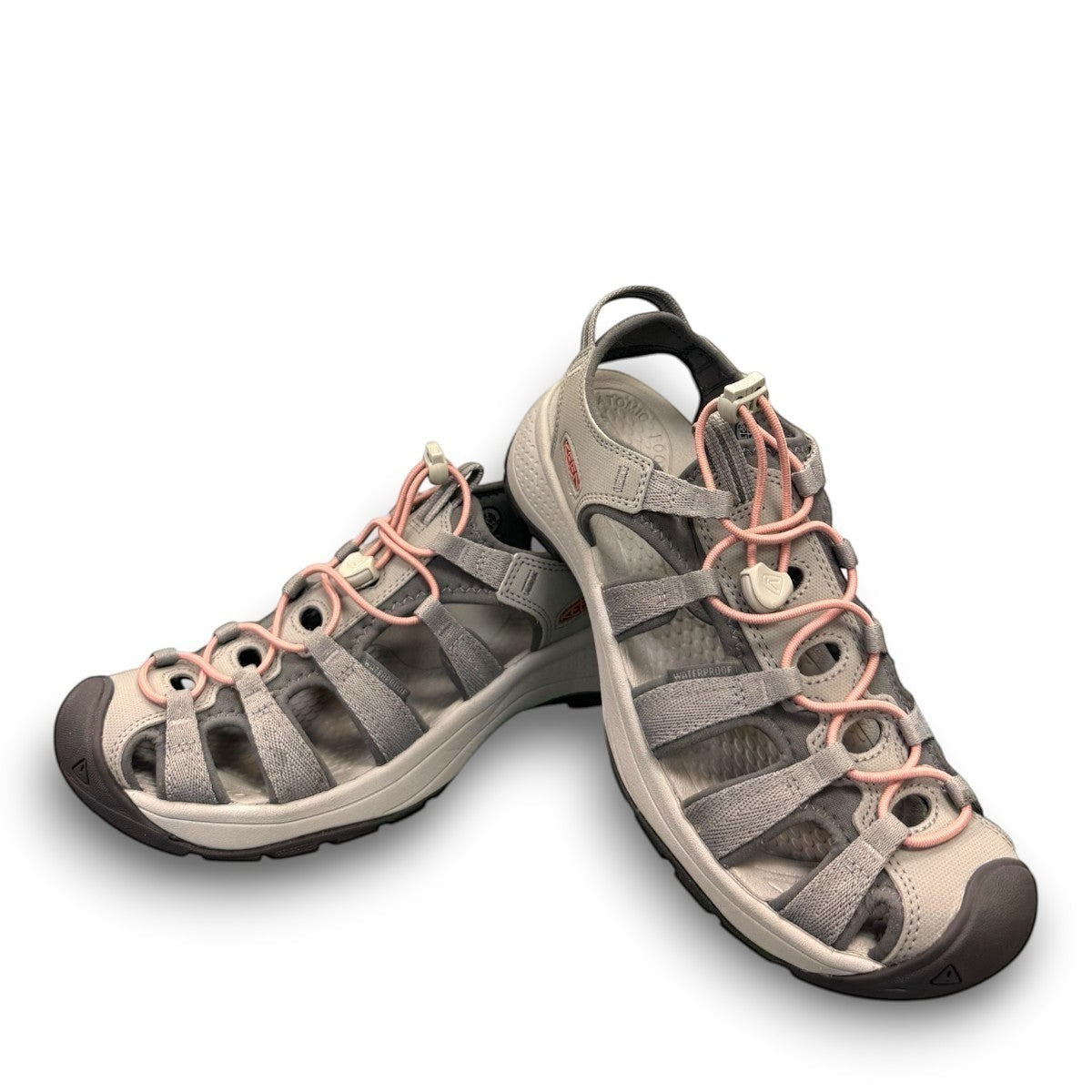 KEEN Astoria West women's hybrid sandal in gray with coral accents. Features recycled materials and a slip-on design.