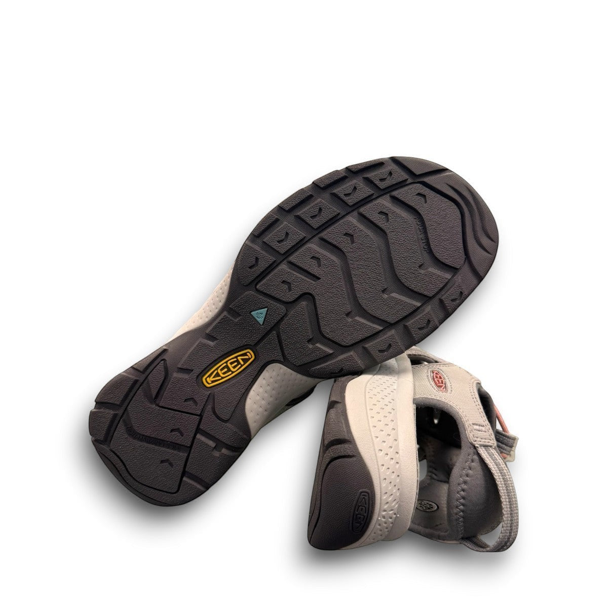 KEEN Astoria West women's hybrid sandal in gray with coral accents. Features recycled materials and a slip-on design.