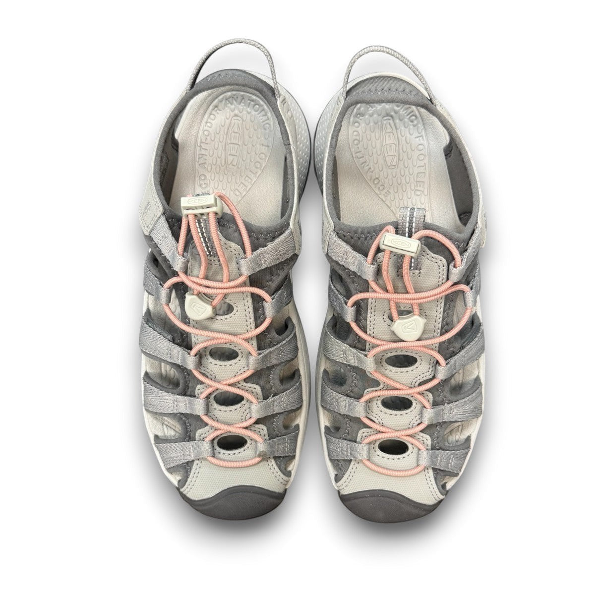 KEEN Astoria West women's hybrid sandal in gray with coral accents. Features recycled materials and a slip-on design.